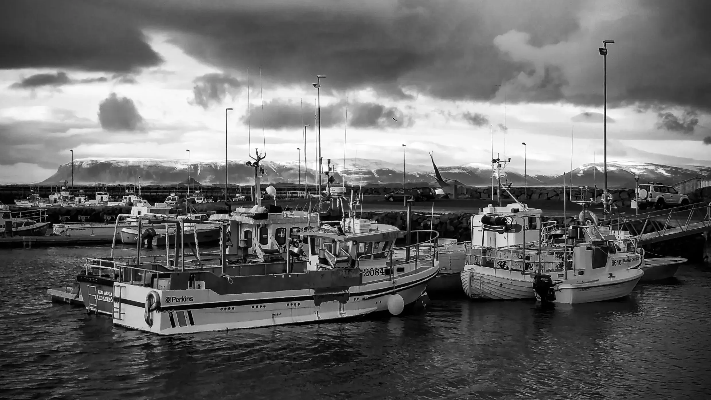 Ruby Horizon: Icelandic Harbor at Sunset